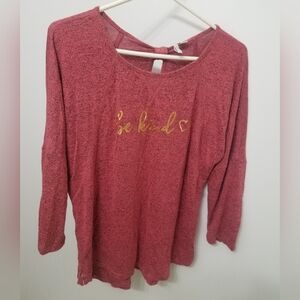 Red blouse with "Be Kind" in gold letters